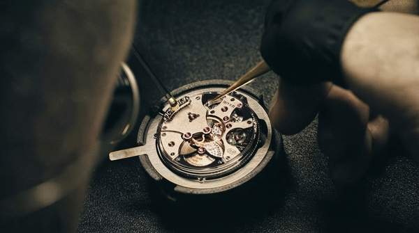 Editorial illustration for Distinguishing Hand-Engraved Guilloché from Machine-Made Watch Dial Patterns